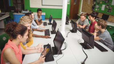 Students learning at compmuters in a classroom