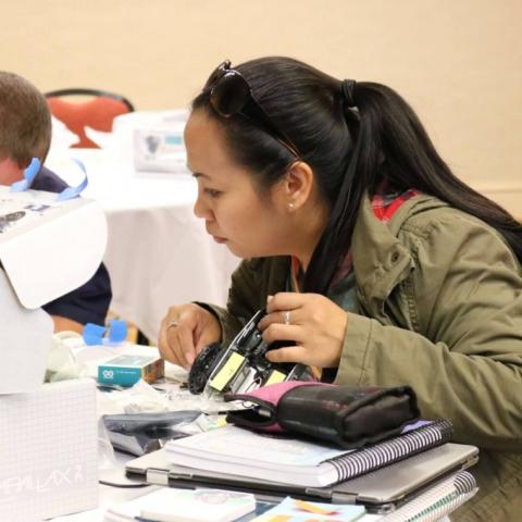 woman working on a robotics project