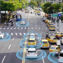 Street view of cars driving down street with graphic overlay of bluetooth radius around cars